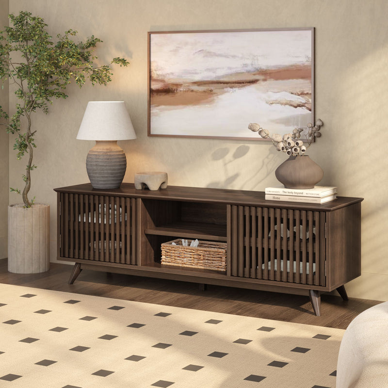 Mid-century modern living room with wooden TV stand, potted plant, abstract painting, and stylish decor accents.