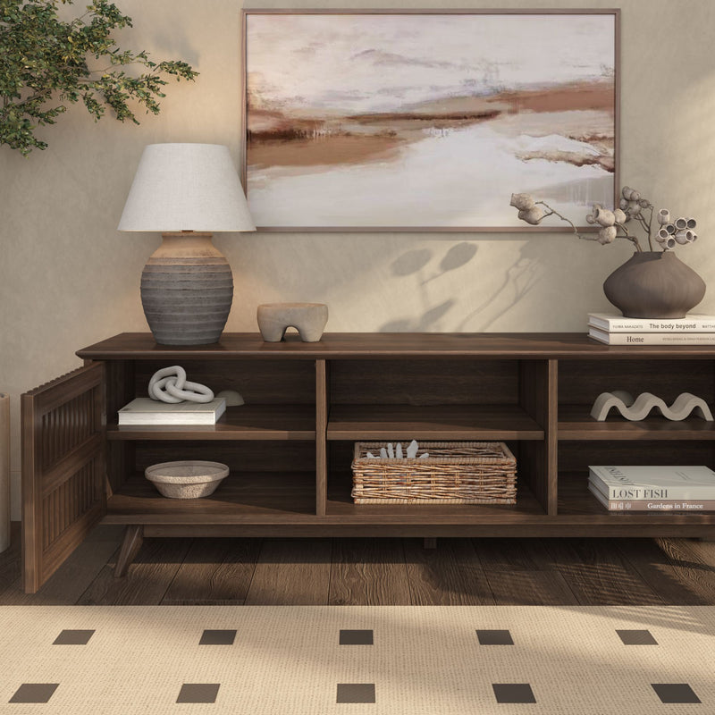 Modern living room interior design with a dark wooden sideboard, decorative vases, and framed landscape painting.