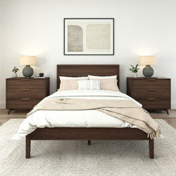 Modern bedroom with wooden bed and nightstands, white bedding, and neutral decor accents.