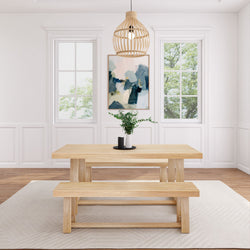 Modern dining room with wooden table, bench seating, and pendant lighting.