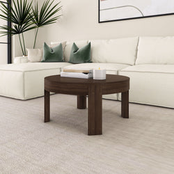 Stylish living room with white sectional sofa and dark wood coffee table.