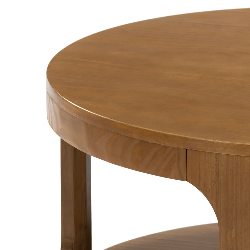 Round wooden coffee table with smooth finish and sturdy legs.