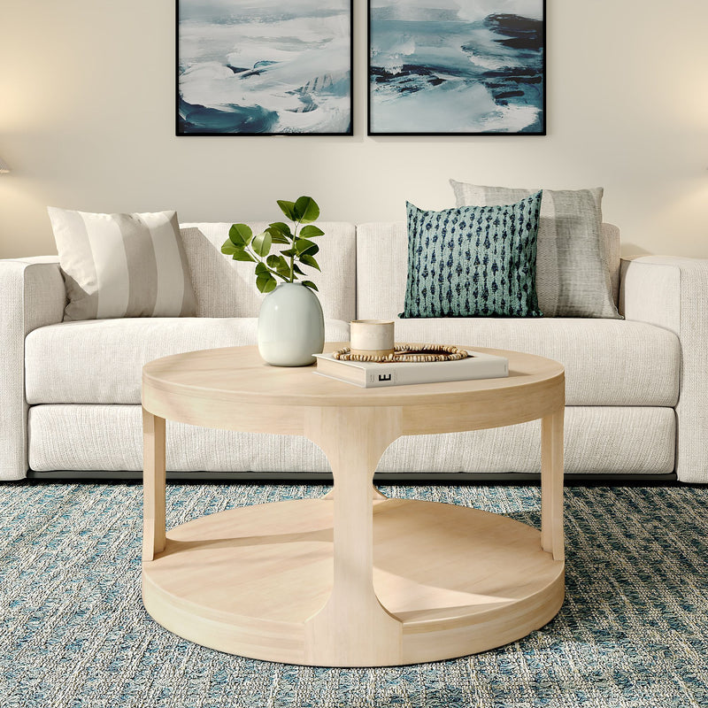 Modern living room with beige sofa, rustic wooden coffee table, and abstract wall art decor.