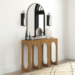 Modern wooden console table with arched mirror and decorative vases in stylish living room.