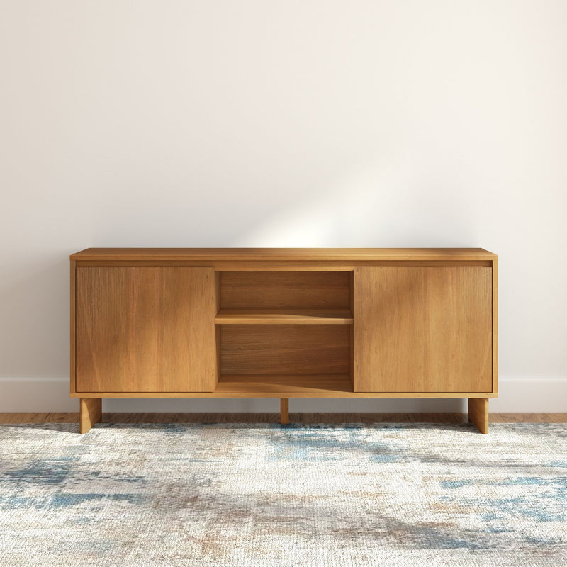 Mid-century modern light wood media console TV stand with cabinet doors and open shelving, minimalist living room storage on patterned area rug
