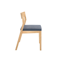 Wooden chair with blue cushion and modern design side view.