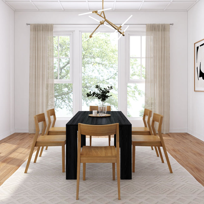 Modern dining room with black table, wooden chairs, and large windows.