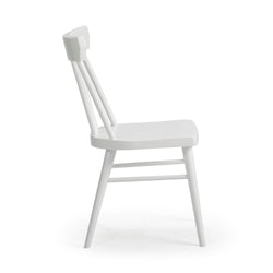 White modern wooden dining chair with spindle back design, side view.