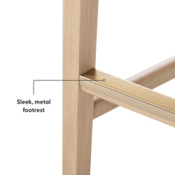 Modern wooden chair with sleek metal footrest for enhanced comfort and style.