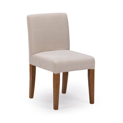 Light beige fabric-upholstered parsons dining chair with solid wood legs, modern armless dining room or kitchen seating on white background