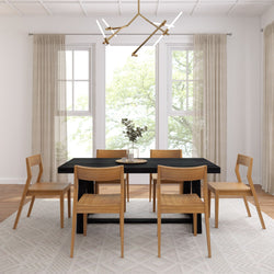 Modern dining room with wooden furniture, black rectangular table, beige curtains, and geometric chandelier.