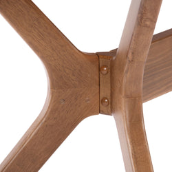 Close-up of wooden chair leg joint showcasing craftsmanship and design detail.