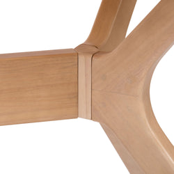 Close-up view of a wooden table leg joint showcasing smooth craftsmanship.