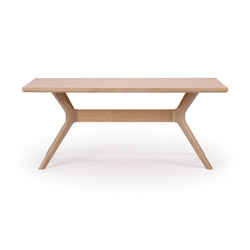 Modern wooden dining table with minimalist design and light oak finish.