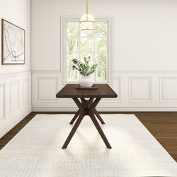 Stylish dining room with modern wooden table, elegant light fixture, and minimalist decor.