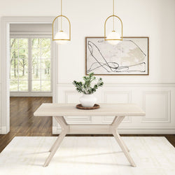 Modern dining room with minimalist wooden table, decorative potted plant, abstract wall art, and pendant lighting.