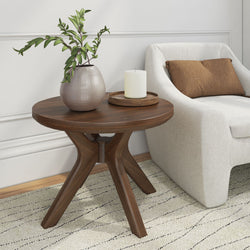 Modern living room decor with wooden side table, beige armchair, and potted plant.