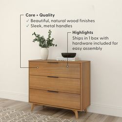 Mid-century modern three-drawer wooden dresser with natural wood finish and slim metal handles, styled with vase and books — easy assembly, ships in one box