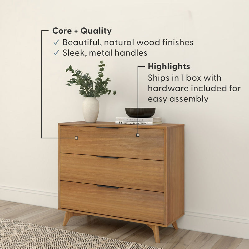 Mid-century modern three-drawer wooden dresser with natural wood finish and slim metal handles, styled with vase and books — easy assembly, ships in one box
