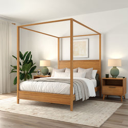 Natural wood four-poster bed in a minimalist Scandinavian bedroom with neutral bedding, mid-century nightstands, green lamps and plant