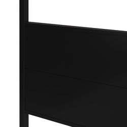 Close-up of modern black metal panel headboard with matte finish on a minimalist bed frame