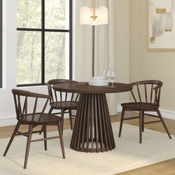Modern wooden dining table set with stylish chairs in a bright room with large window and contemporary decor.