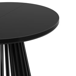 Modern black round dining table with sleek design and stylish base.