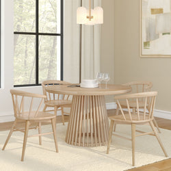 Elegant modern dining room with a round wooden table and chairs, featuring a pendant light and minimalist decor.