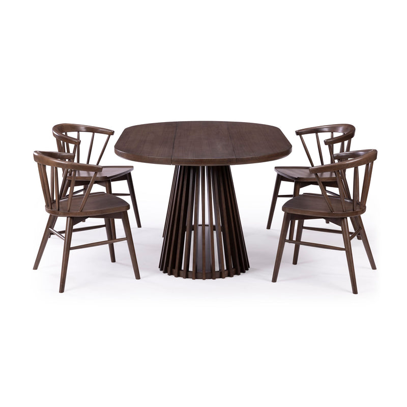 Mid-century modern dark walnut round dining table with spindle pedestal and four matching Windsor-style wooden chairs