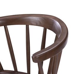 Elegant wooden chair with smooth curved backrest and vertical spindles.