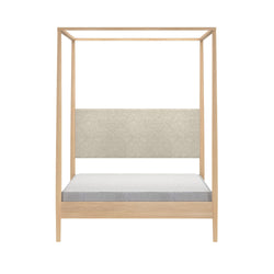 Minimalist light oak four-poster canopy bed with beige upholstered headboard and gray mattress on white background