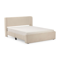 Modern beige upholstered bed frame with headboard and mattress in a minimalist bedroom setting.