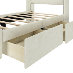 Beige upholstered bed frame with open storage drawers.