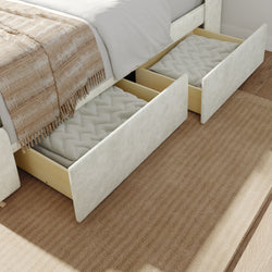 Under-bed storage drawers with blankets, enhancing bedroom organization and maximizing space.