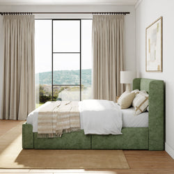 Luxurious bedroom interior with green upholstered bed, beige curtains, and serene window view.