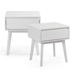 White modern bedside tables with drawers and angled legs.