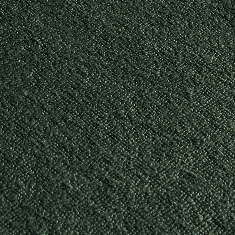 Dark green velvet fabric texture close-up, plush upholstery material for sofa, cushion and curtains