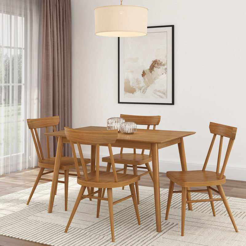 Mid-century modern dining room set with wooden table and chairs in a bright, stylish interior.
