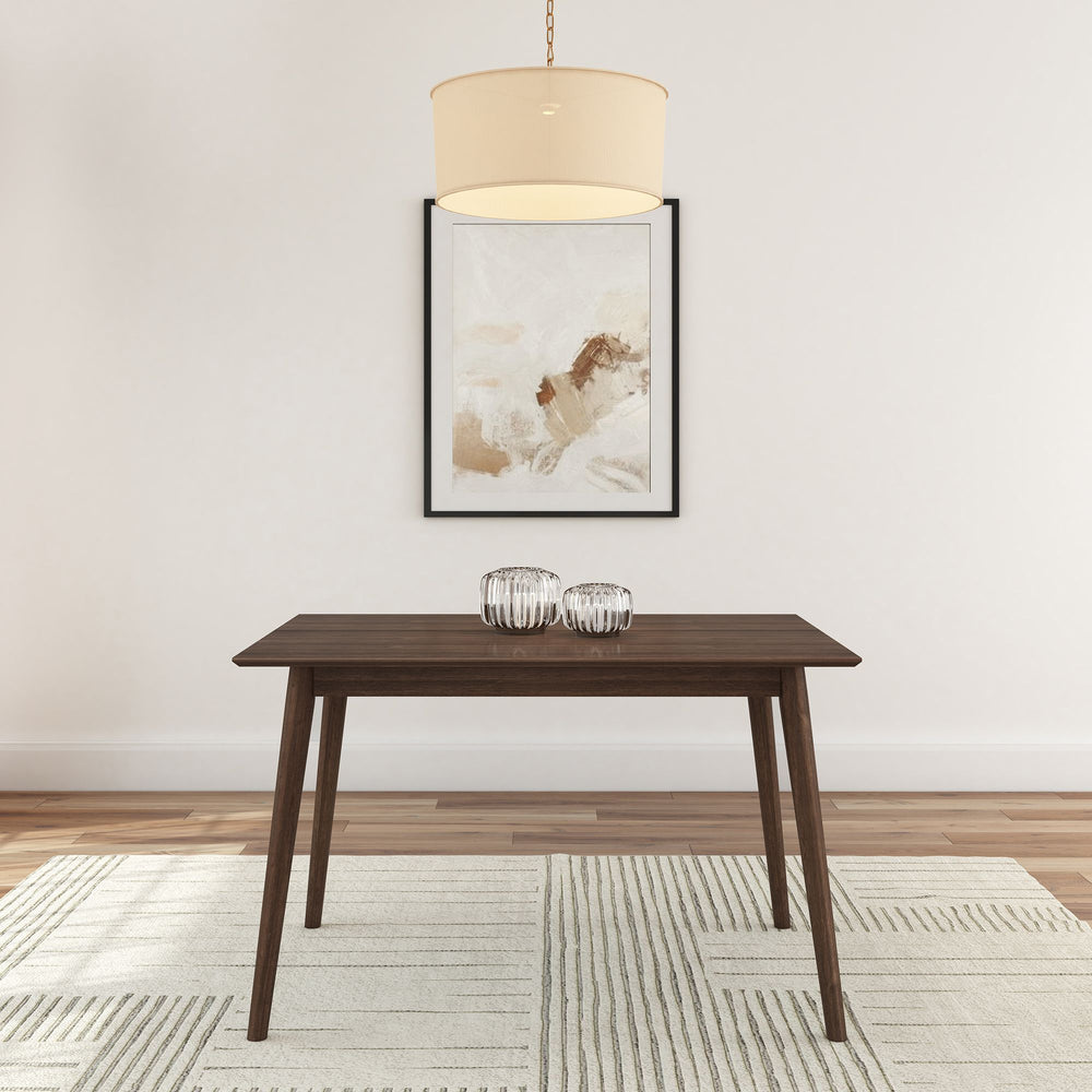 Minimalist dining room with wooden table, abstract wall art, and modern chandelier.