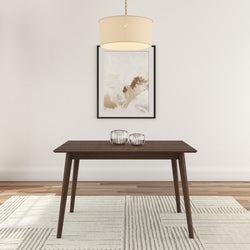 Minimalist dining room with wooden table, abstract wall art, and modern chandelier.