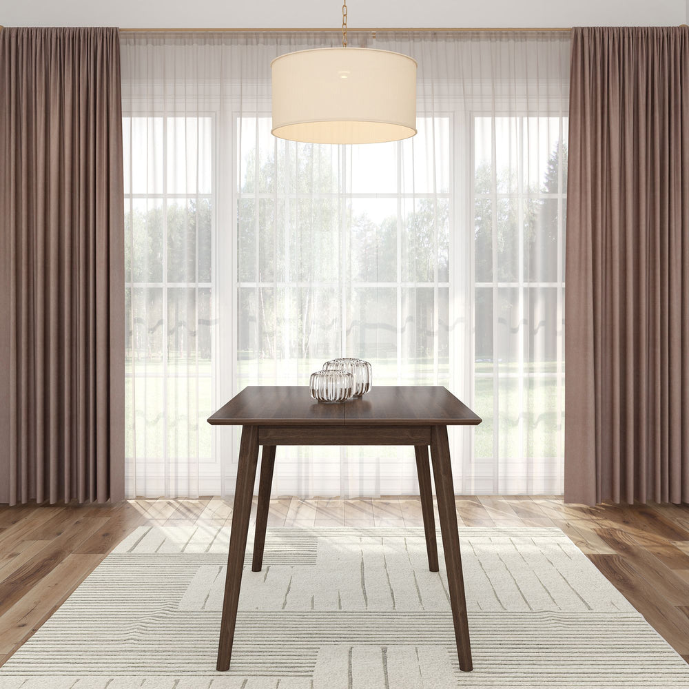 Modern dining room with elegant wooden table, pendant light, and floor-to-ceiling curtains.
