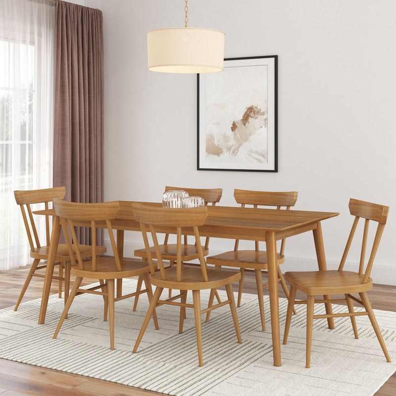 Modern dining room with wooden table and chairs set, featuring minimalist decor and a large window.