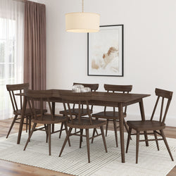 Modern dining room with wooden table and chairs on a light rug, featuring a pendant light and abstract wall art.