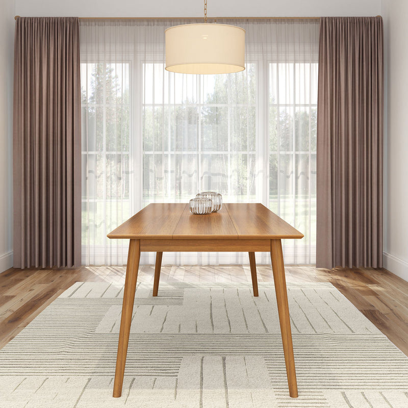 Modern dining room with elegant wooden table and contemporary lighting fixture.