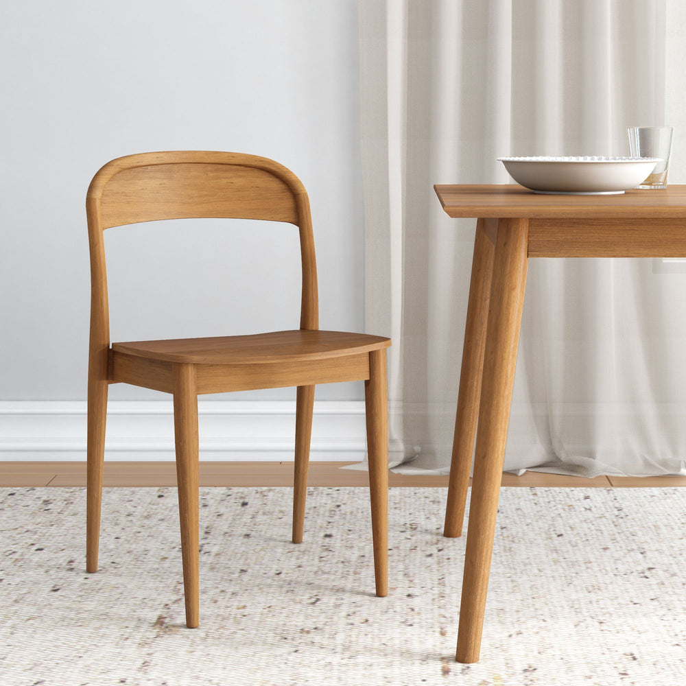 Stylish wooden chair and dining table set with minimalist design in a modern dining room.