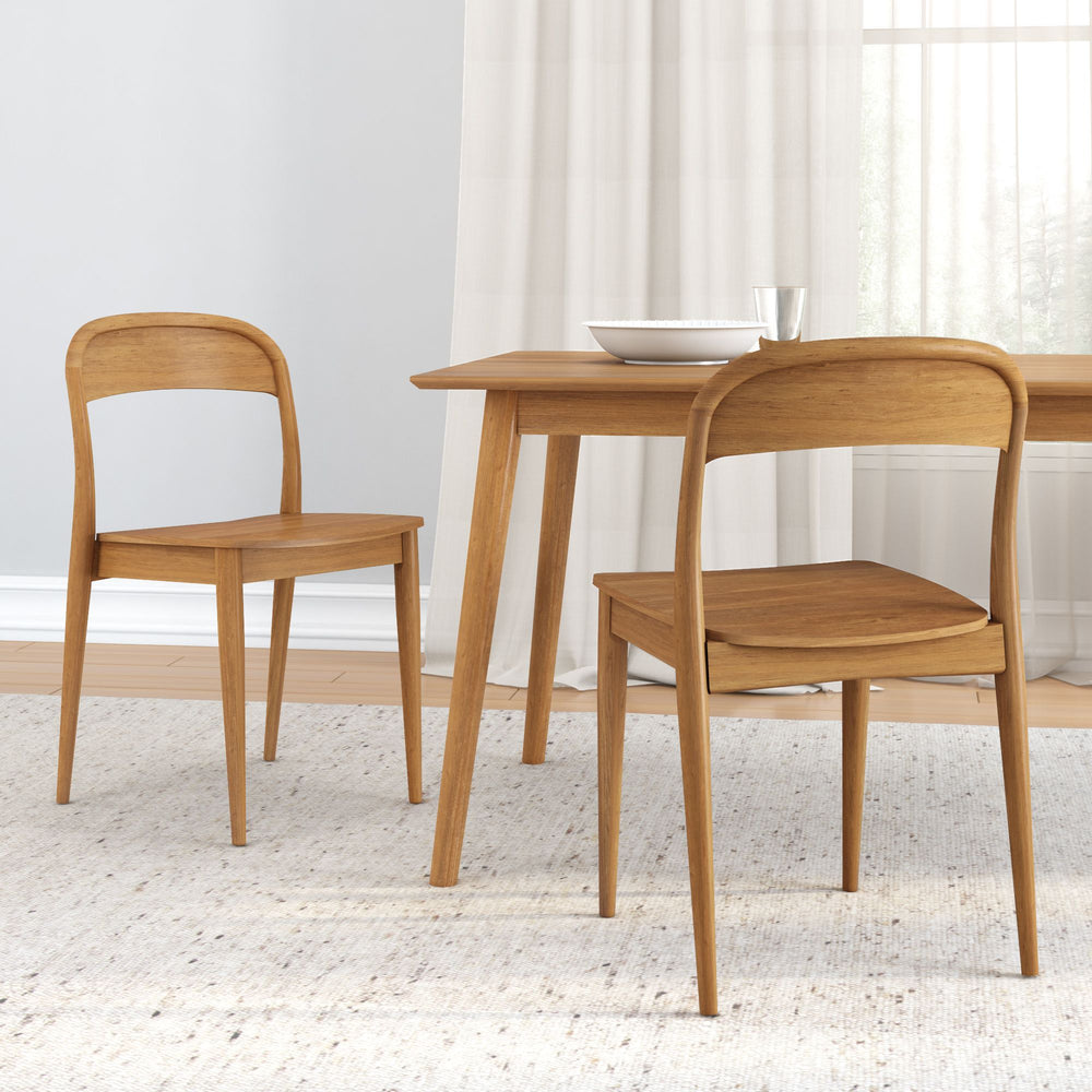 Modern wooden dining set with two chairs and a table in a minimalist interior.