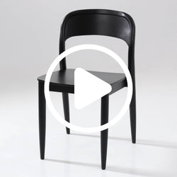 Black wooden chair with curved backrest on white background.