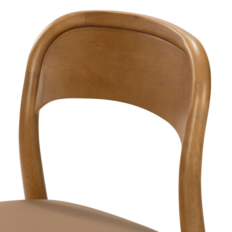 Close-up of a mid-century modern light brown wooden dining chair with a curved beech backrest and tan upholstered seat