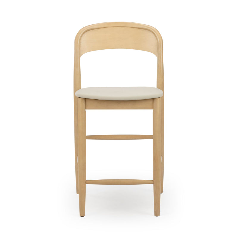 Mid-century modern light wood bar stool with beige padded seat, curved backrest and footrest on white background