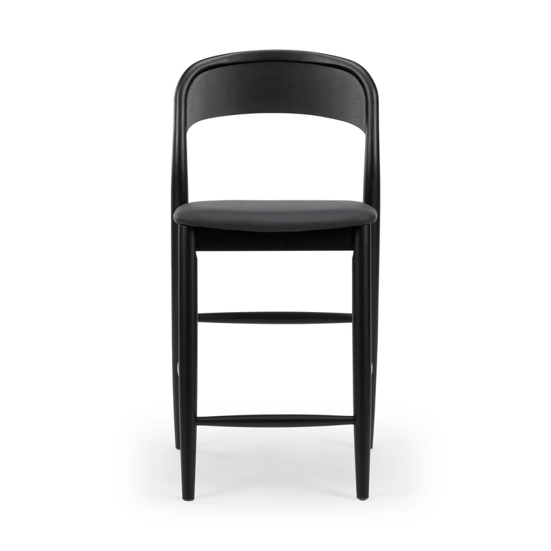 Black modern wooden bar stool with padded seat, curved backrest, tapered legs and footrest, ideal for kitchen island or breakfast bar
